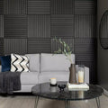 Modern living room with gray sofa, marble coffee table, and decorative wall panels.