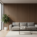 Modern living room with a gray sofa, coffee table, and plant against a walnut acoustic slatted wall.
